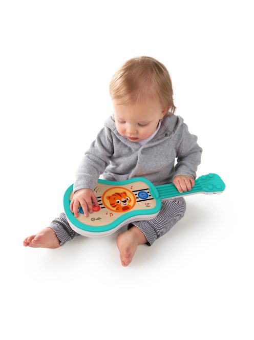 BABY EINSTEIN Zenélő fa játék ukulele Magic Touch HAPE 6hó+