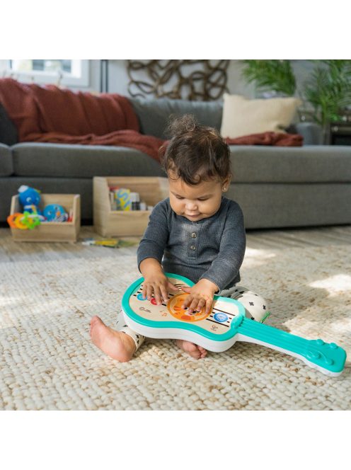 BABY EINSTEIN Zenélő fa játék ukulele Magic Touch HAPE 6hó+