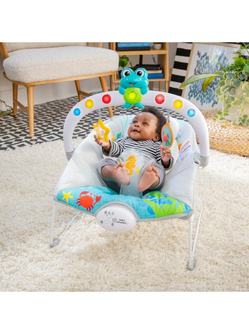 BABY EINSTEIN Zenélő rezgő pihenőszék fényekkel Kick to It Neptune 9 kg-ig